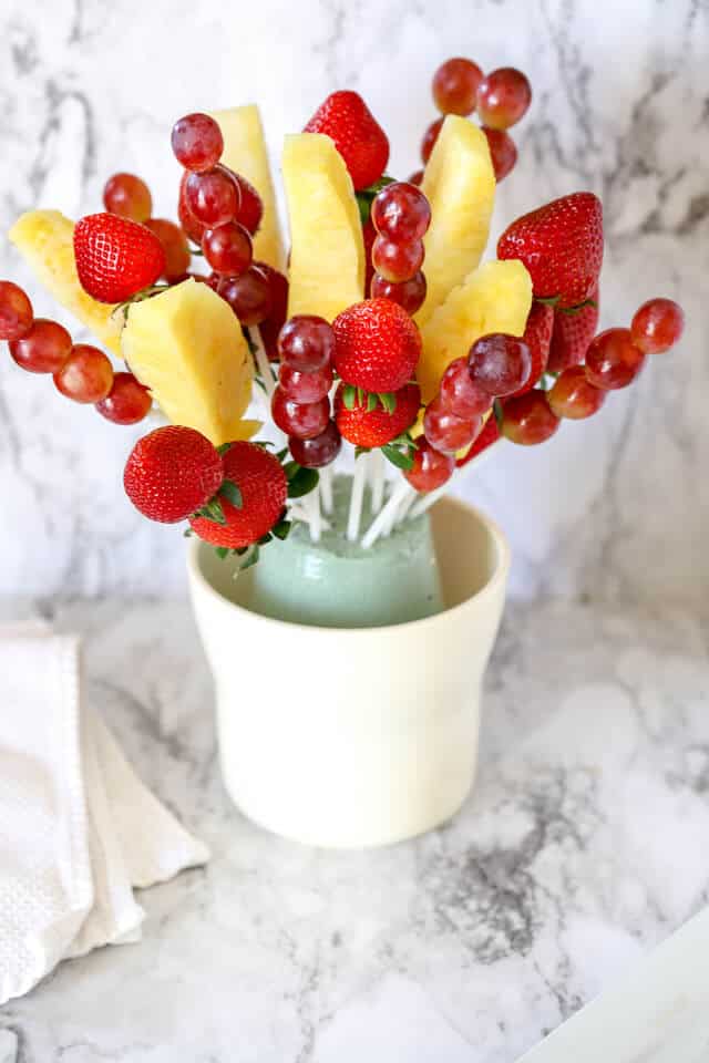 Fruit bouquet with strawberries, pineapple, and grapes and styrofoam base