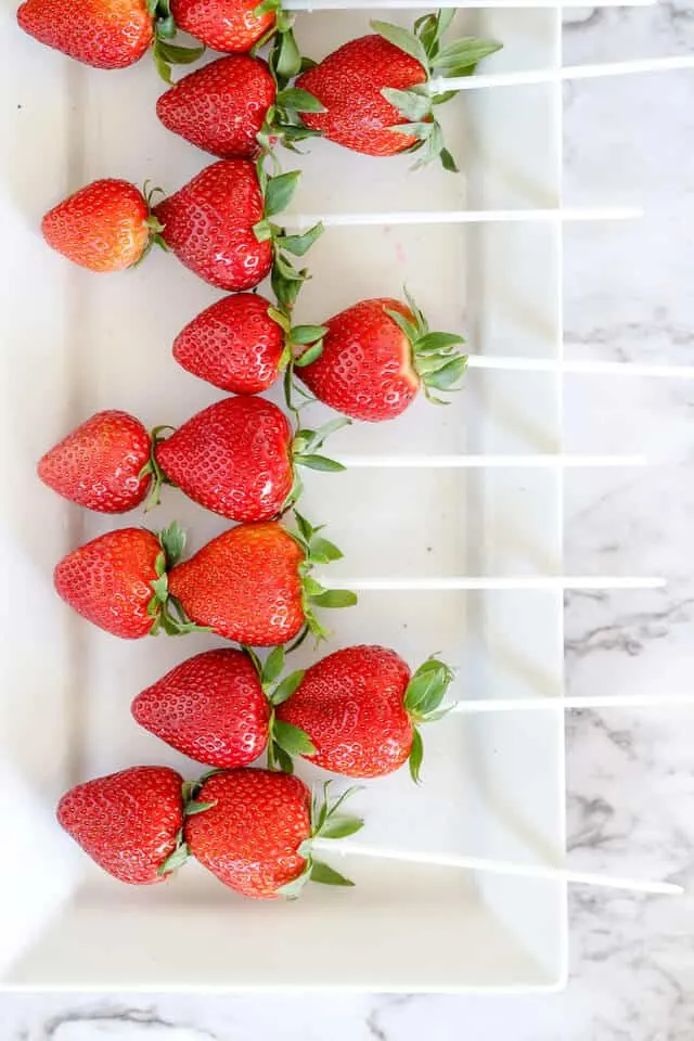 strawberries on plastic skewers for fruit arrangement