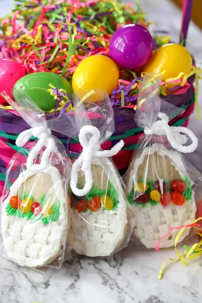 Easter Basket Cookie Gifts wrapped in plastic gift bags and tied with ribbon