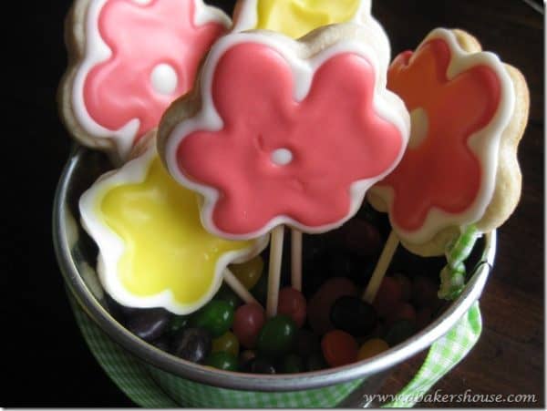 Flower cookies on popsicle sticks that form a cookie bouquet