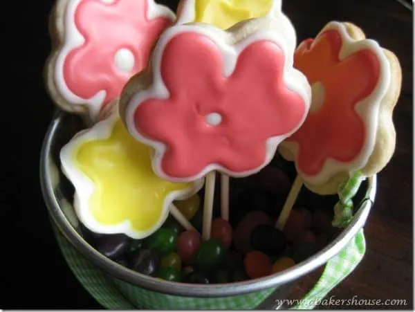 Flower cookies on popsicle sticks that form a cookie bouquet