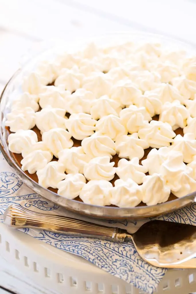 Chocolate pudding pie with piped whipped cream topping