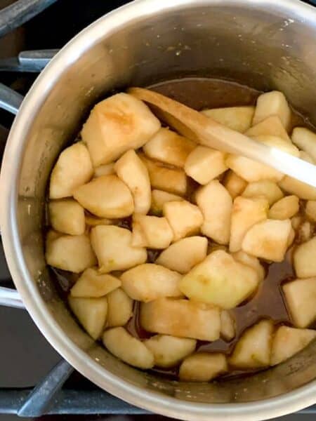 ingredients for pear jam in a saucepan on the stovetop