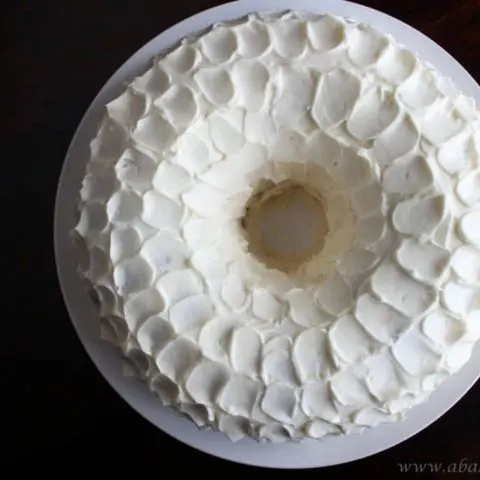 Overhead photo of ginger pear Bundt cake with cream cheese frosting.