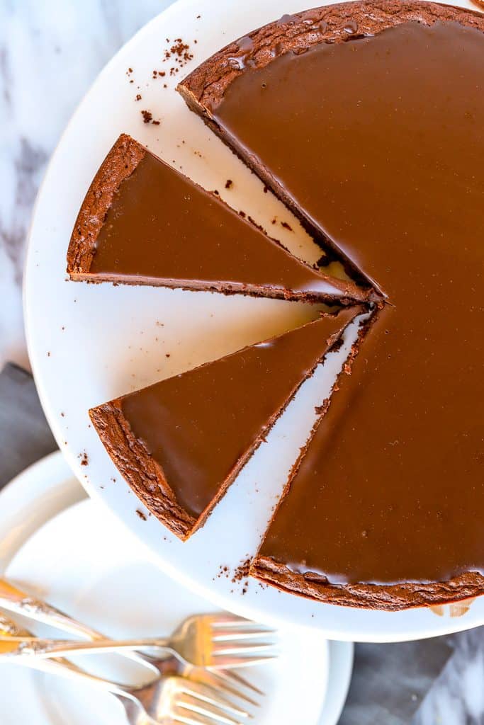 Overhead slices of flourless chocolate cake with ganache