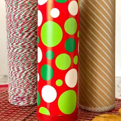 Creative Gift Packaging for Cookies using a Pringles Can. Three decorated cans.