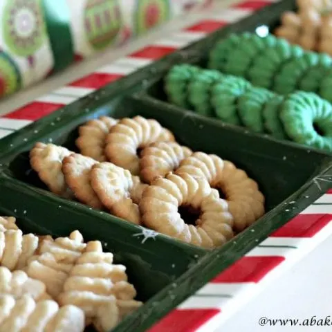 Christmas Spritz Cookies in the shape of trees and wreaths