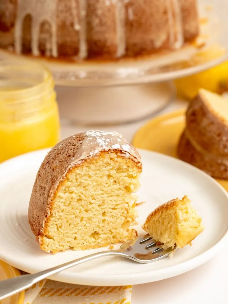 slice of gluten free lemon cake with piece on fork