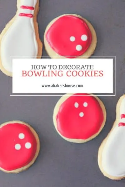 bowling cookies decorated in white and red royal icing with text title overlay