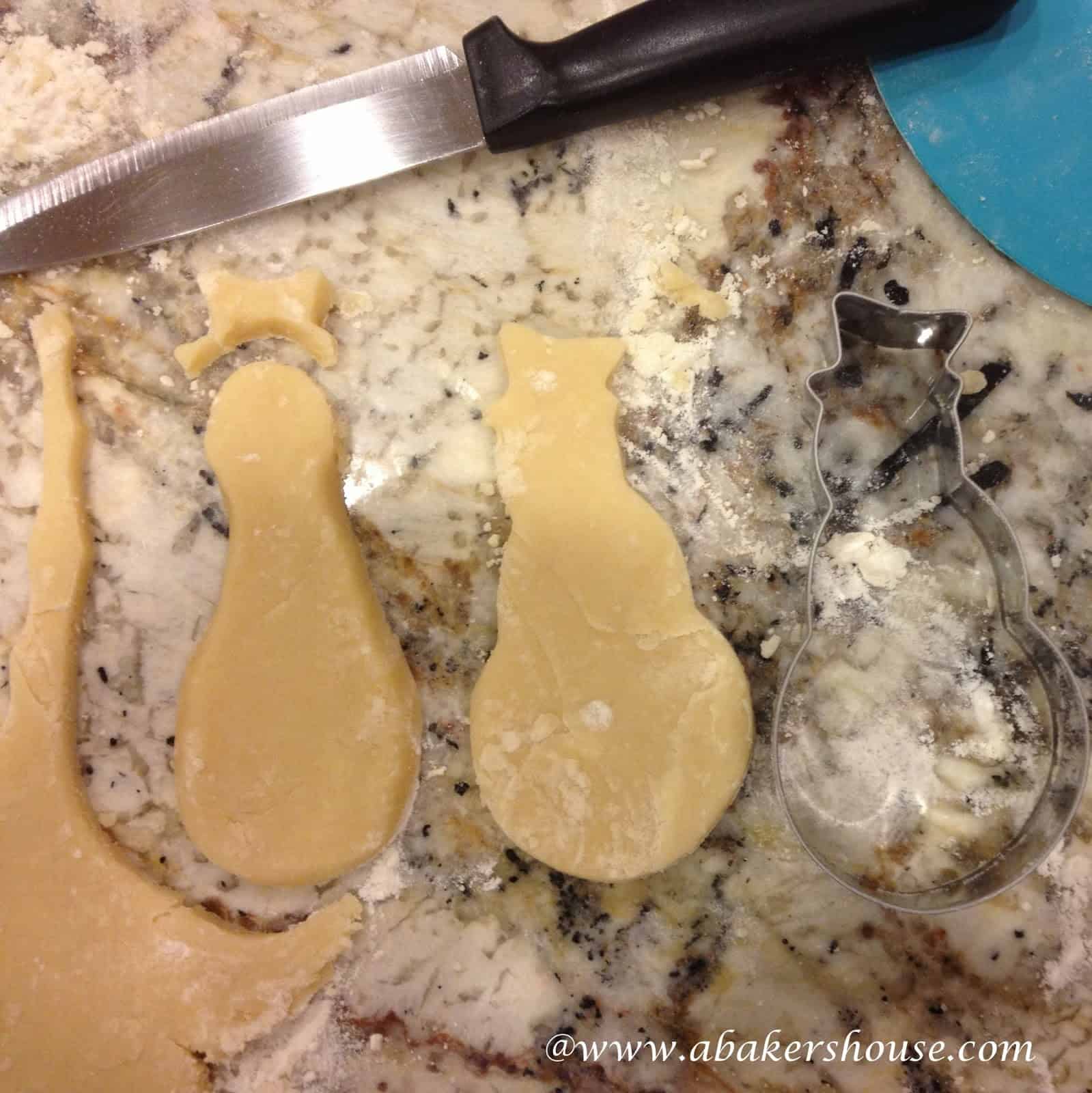 Make bowling pin cookies using a snowman cookie cutter