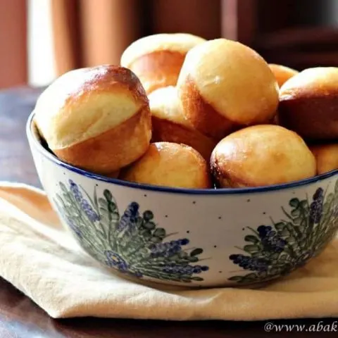 Brioche rolls in a pottery bowl