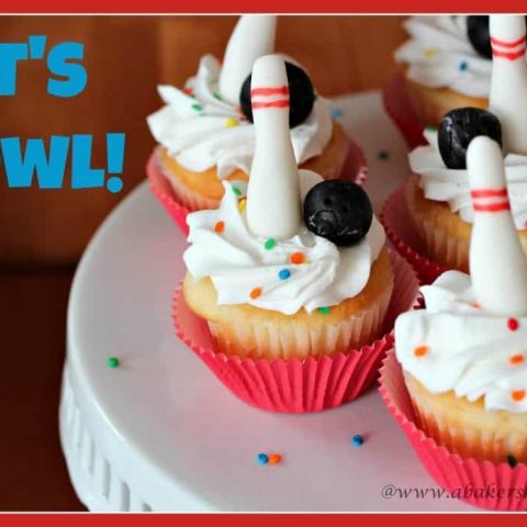 Cupcakes decorated with fondant bowling pins and balls