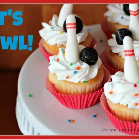 Cupcakes decorated with fondant bowling pins and balls