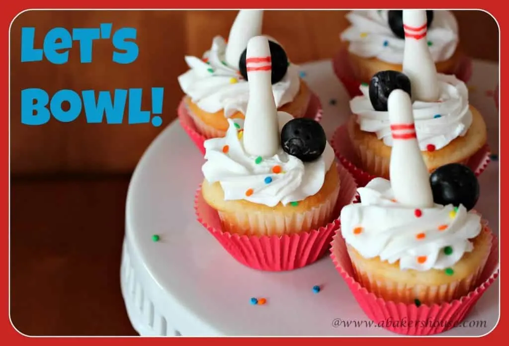 Cupcakes decorated with fondant bowling pins and balls