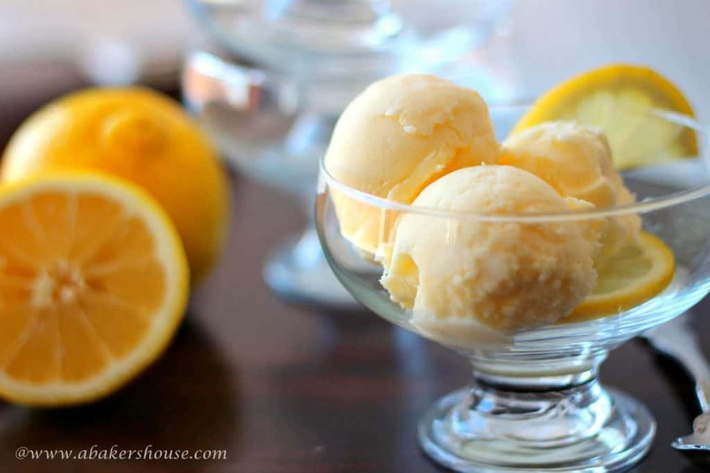 Scoops of lemon frozen yogurt in glass bowl