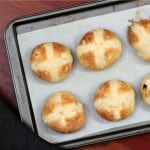 overhead photo of six hot cross buns on a tray