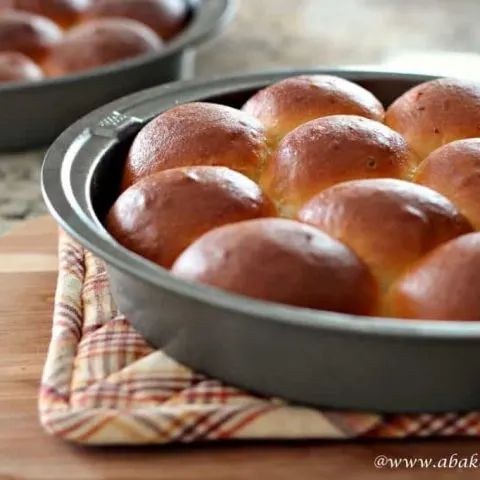 Homemade potato rolls in a metal pan