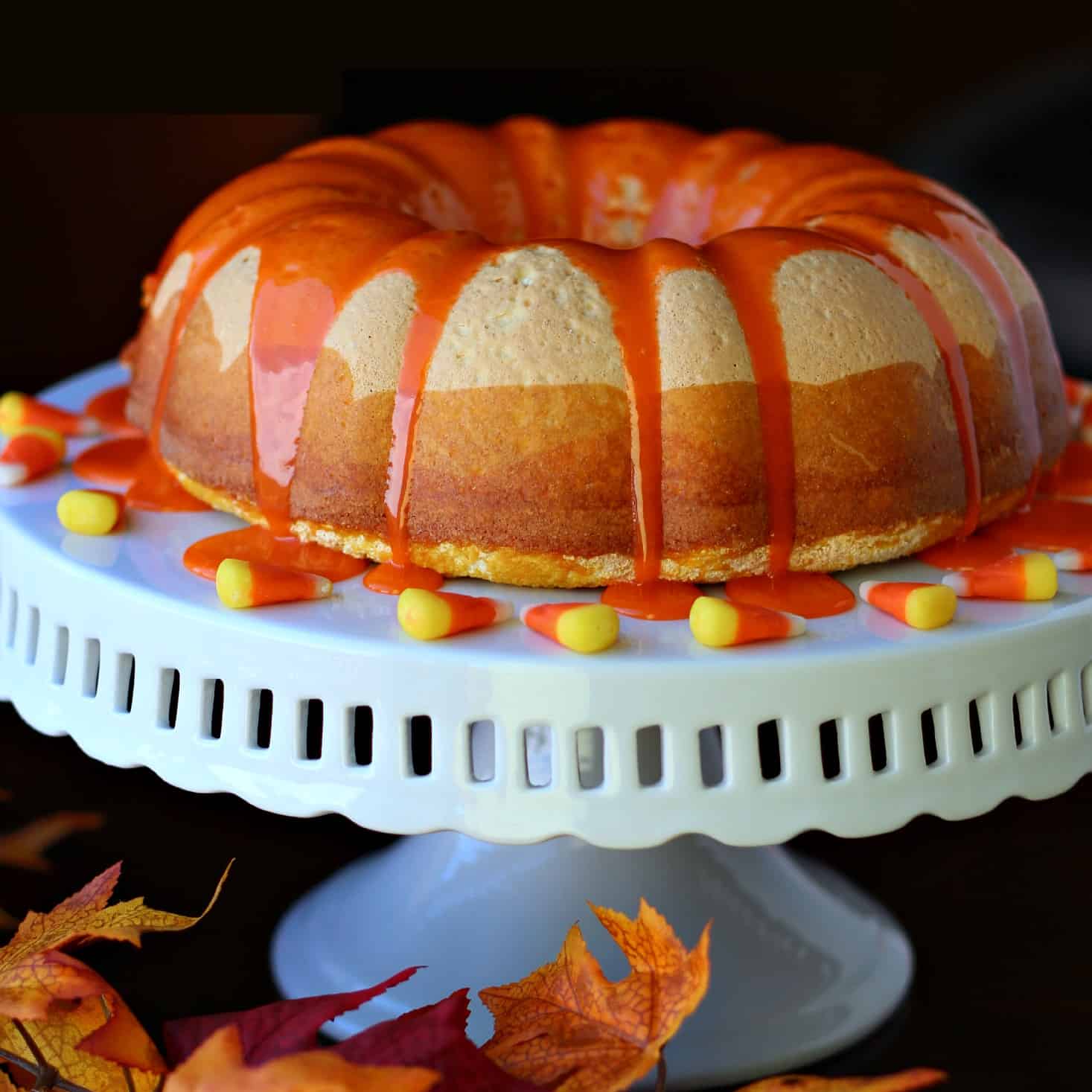 Candy Corn Bundt cake on a white cake platter