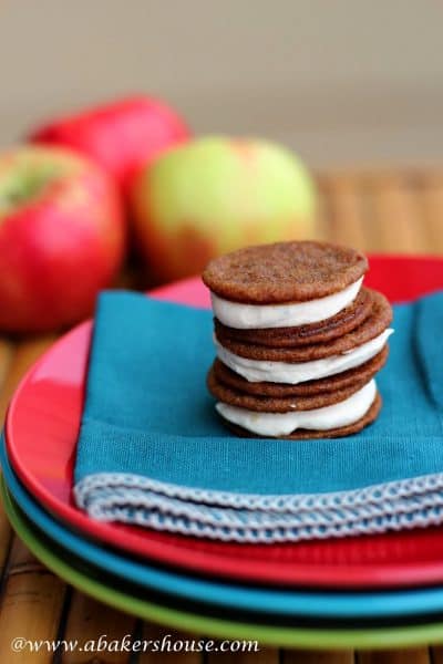 Stack of three ginger sandwich cookies with apple buttercream filling