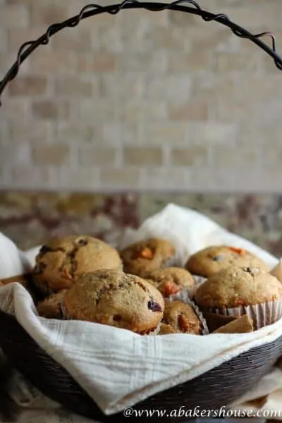 Spiced muffins with persimmons in a basket