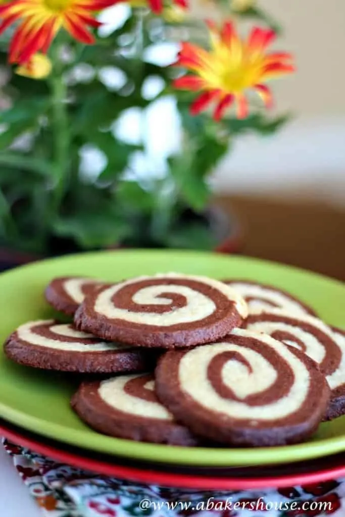 espresso pinwheel cookies on a green plate