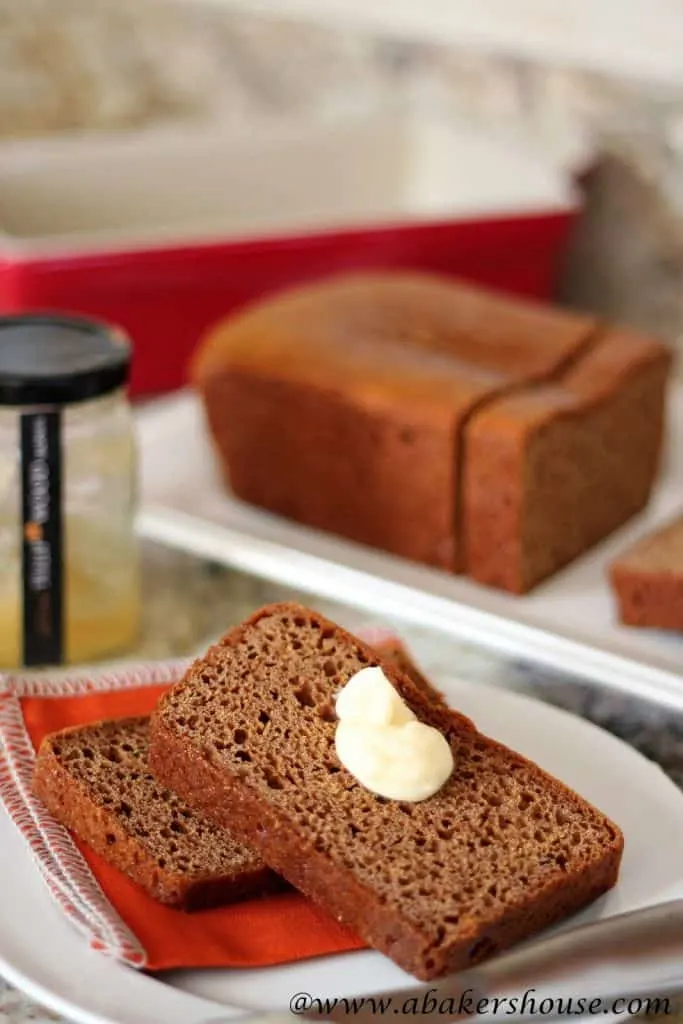 Honey Spice Cake sliced with honey butter on white plate