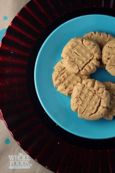 plate of dairy free peanut butter cookies overhead view on blue plate and red plate