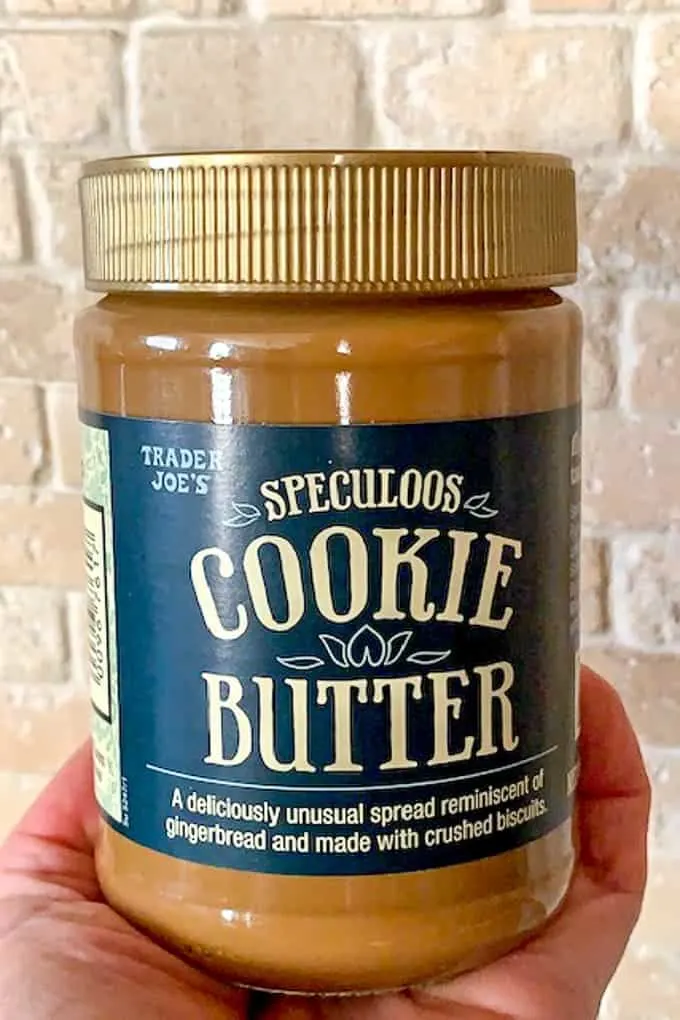 Jar of cookie butter from Trader Joes held by a hand