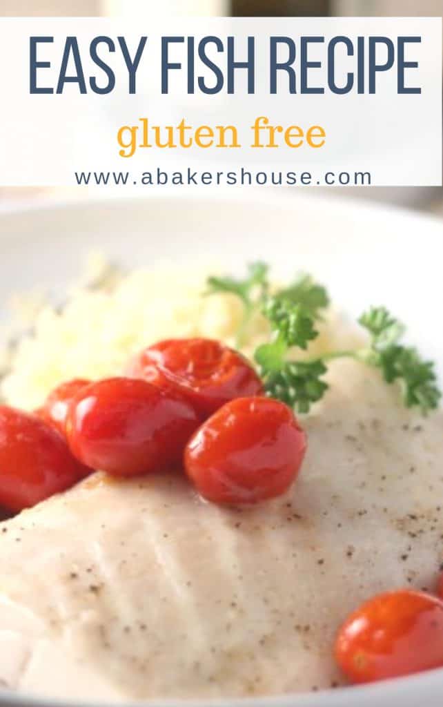 white fish with roasted tomatoes and parsley on a white plate