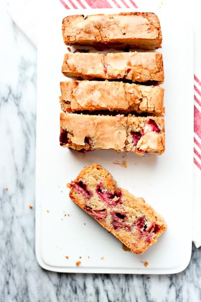 Strawberry bread sliced overhead photo on white plate