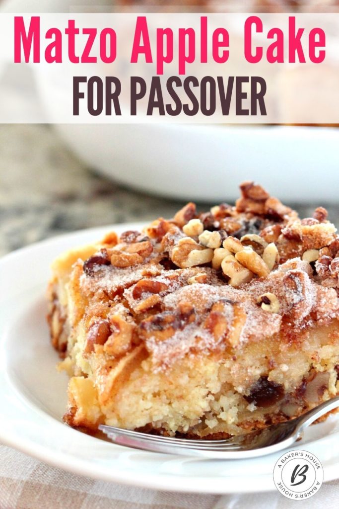 large piece of matzo apple cake on white plate with fork