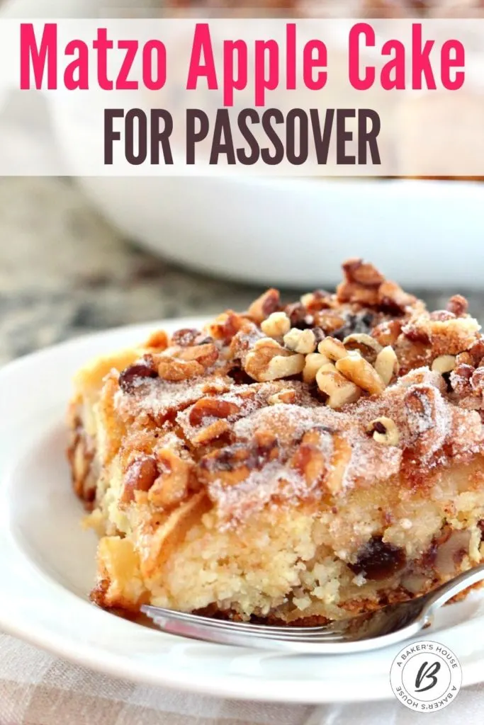 large piece of matzo apple cake on white plate with fork