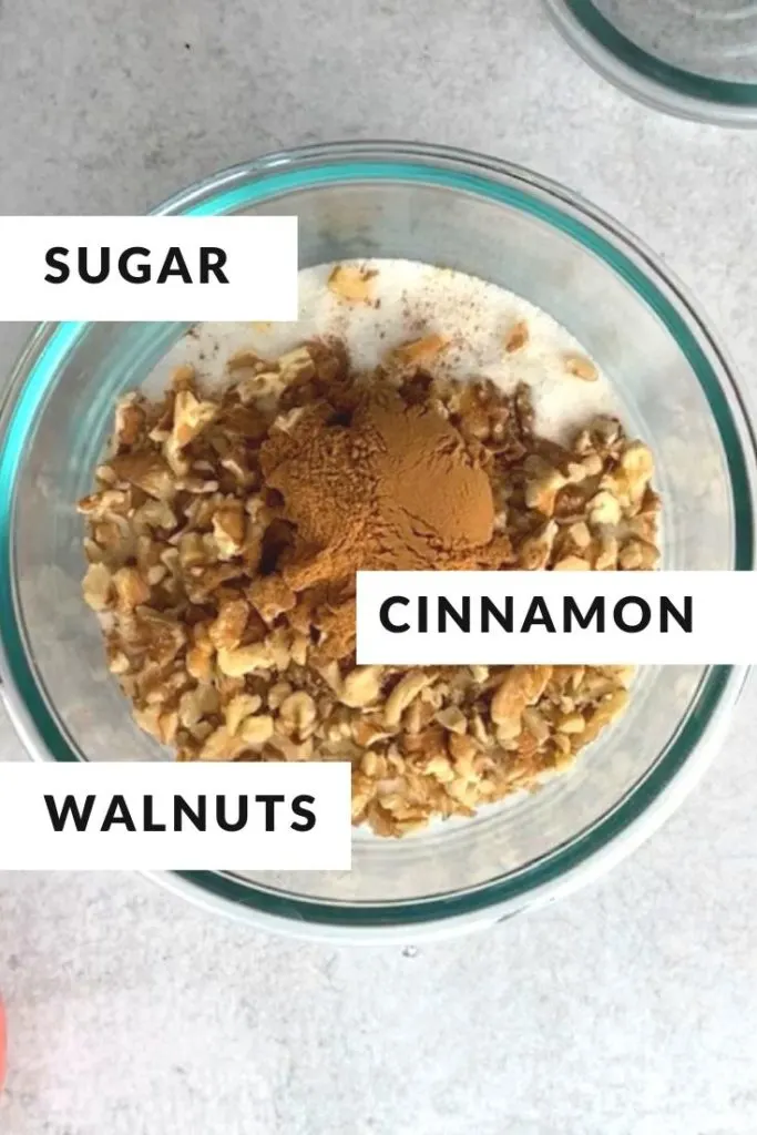 ingredients of sugar, cinnamon, walnuts in glass bowl