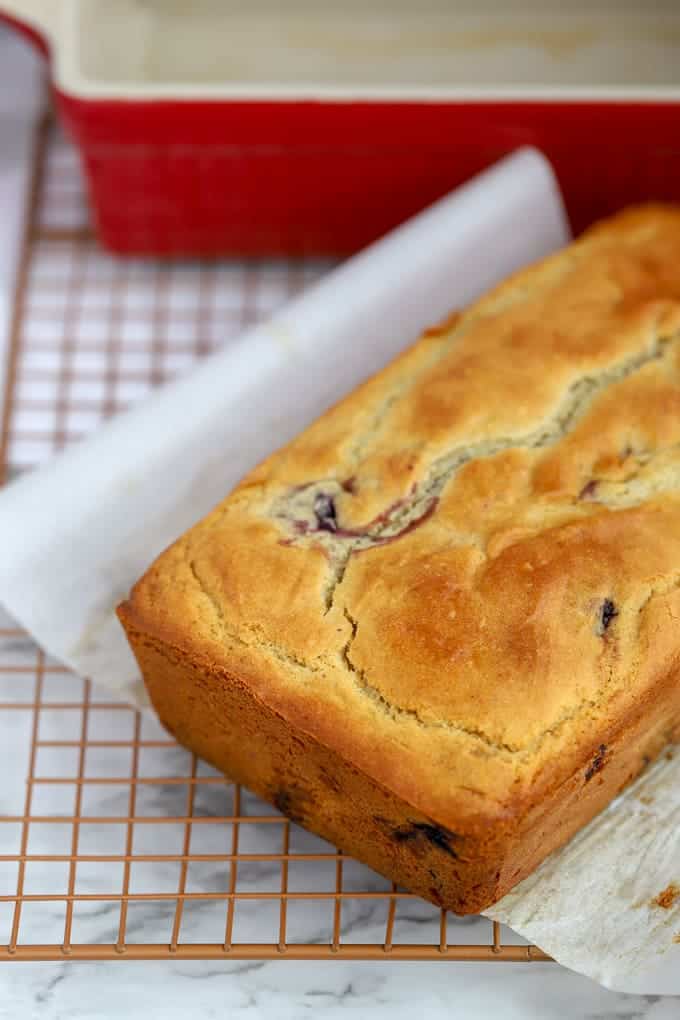 Baked cherry quick bread on wire cooling rack