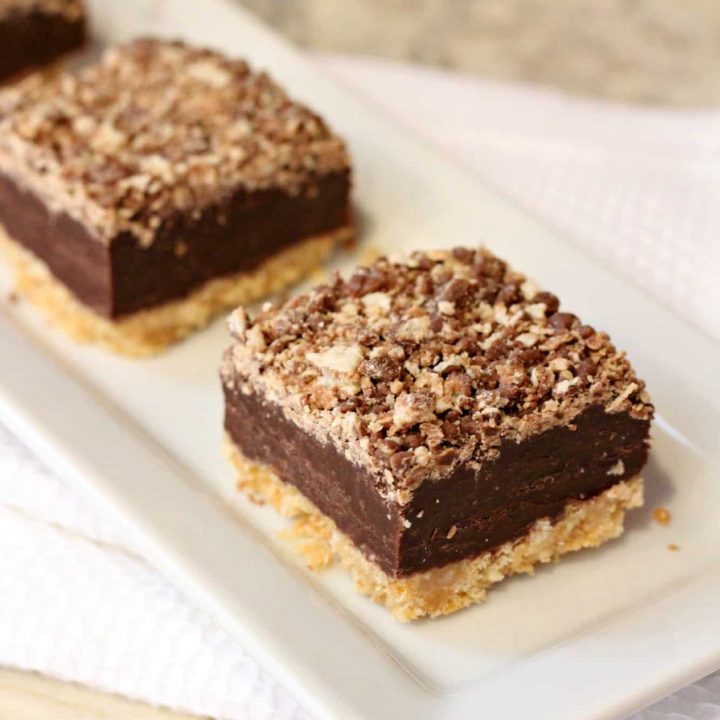 three kit kat bars on a white plate