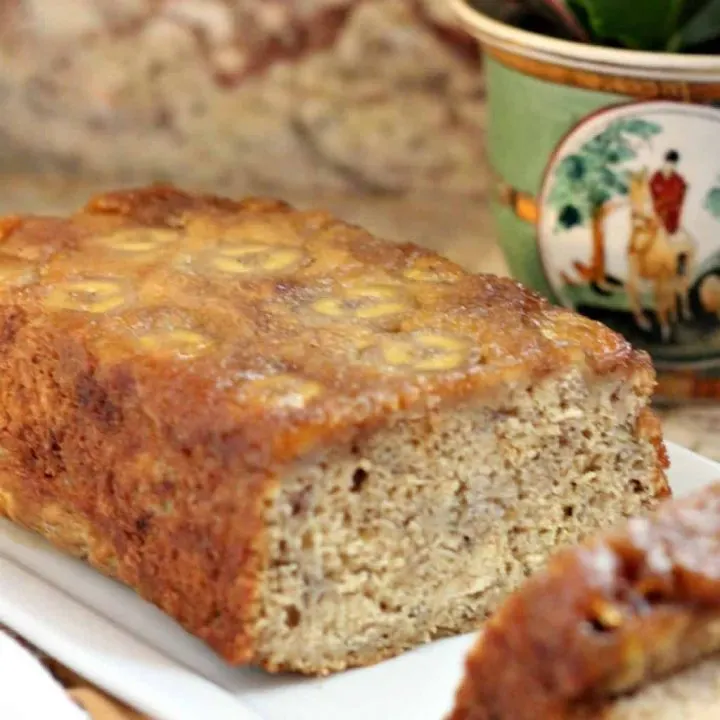 upside down banana bread sliced on white plate