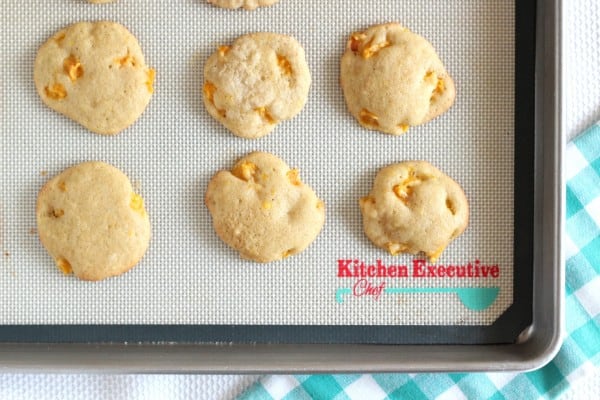 six nectarine drop cookies on baking sheet