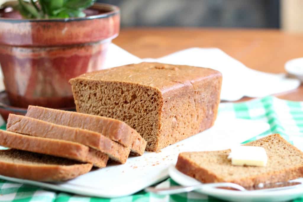 whole wheat bread sliced on a white plate