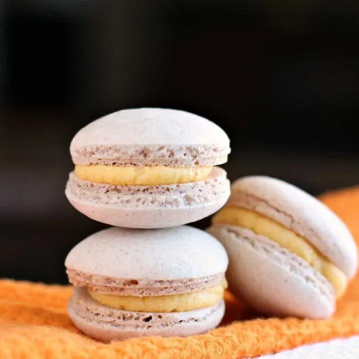 Stack of three pumpkin macarons