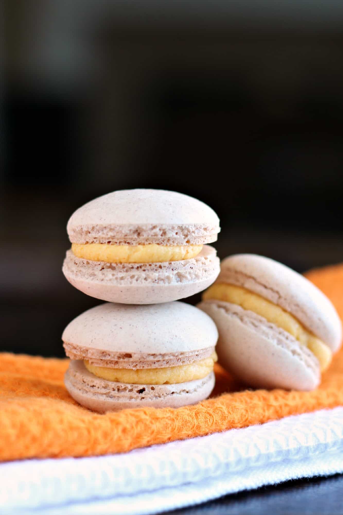 Stack of three pumpkin macarons