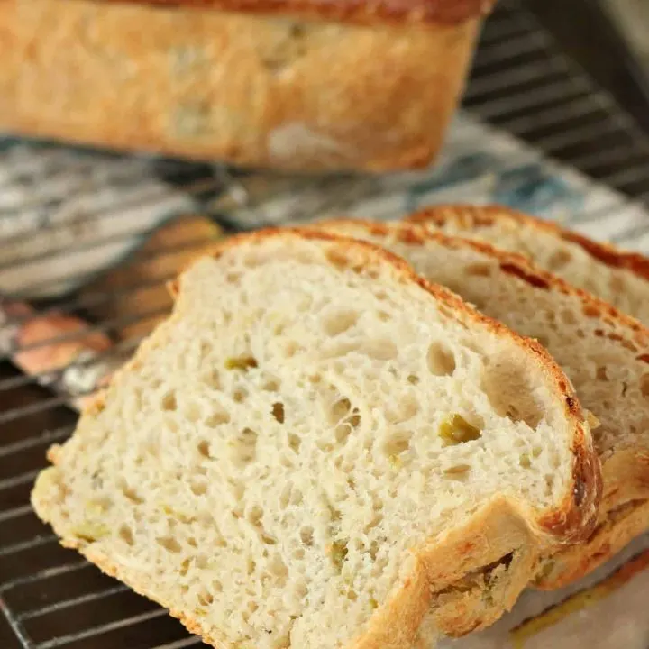 sliced hatch chile bread with loaf in background