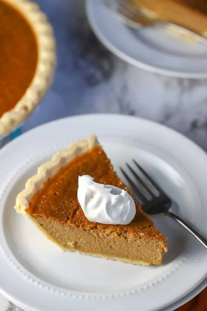 gluten free pumpkin pie slice with whipped cream