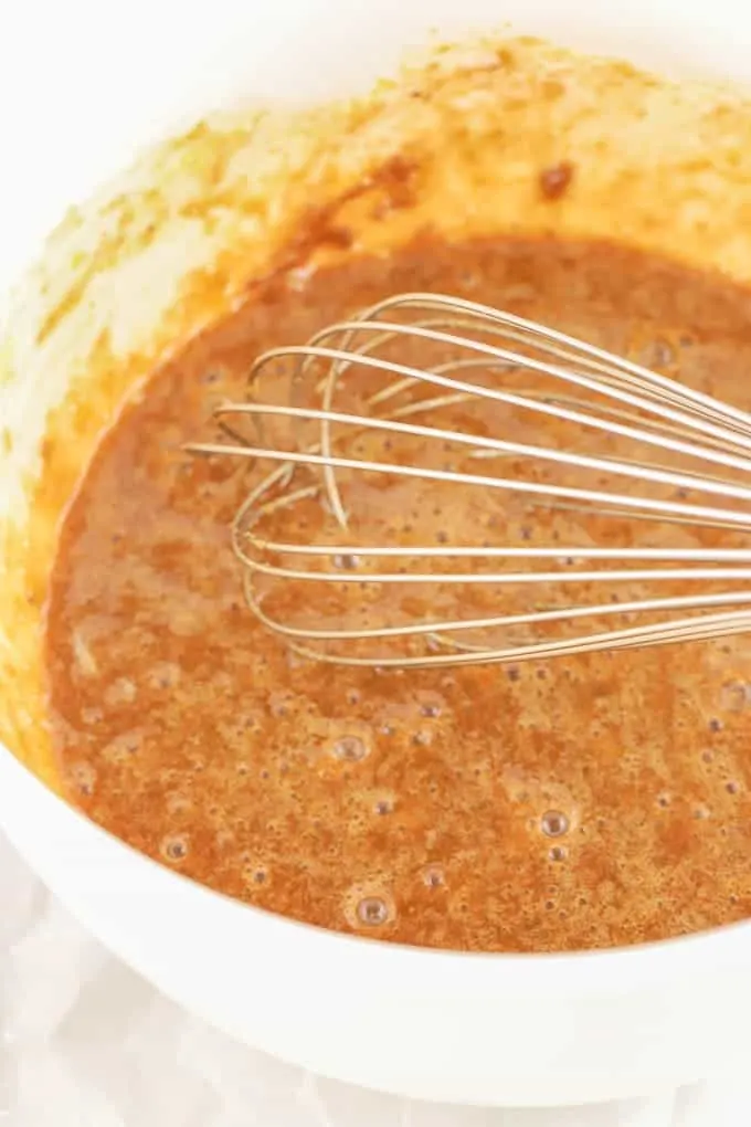 whisk in white bowl for gluten free pumpkin pie filling