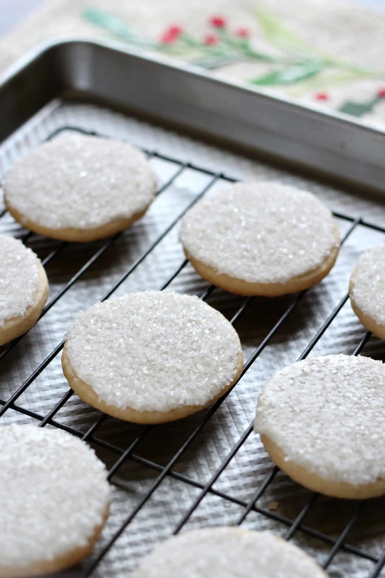 Sugar cookies with sprinkles on a wire cooling rack