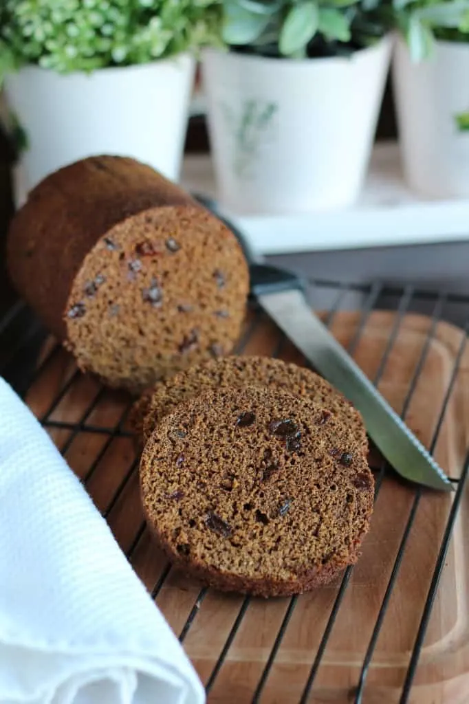 Boston Brown Bread baked in a can then sliced on cutting board
