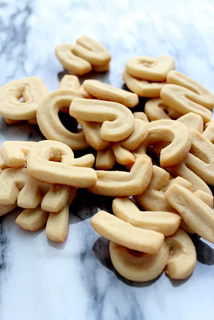 Pile of letter cookies on a marble board