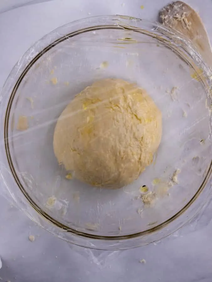 calzone smooth ball of dough in glass bowl