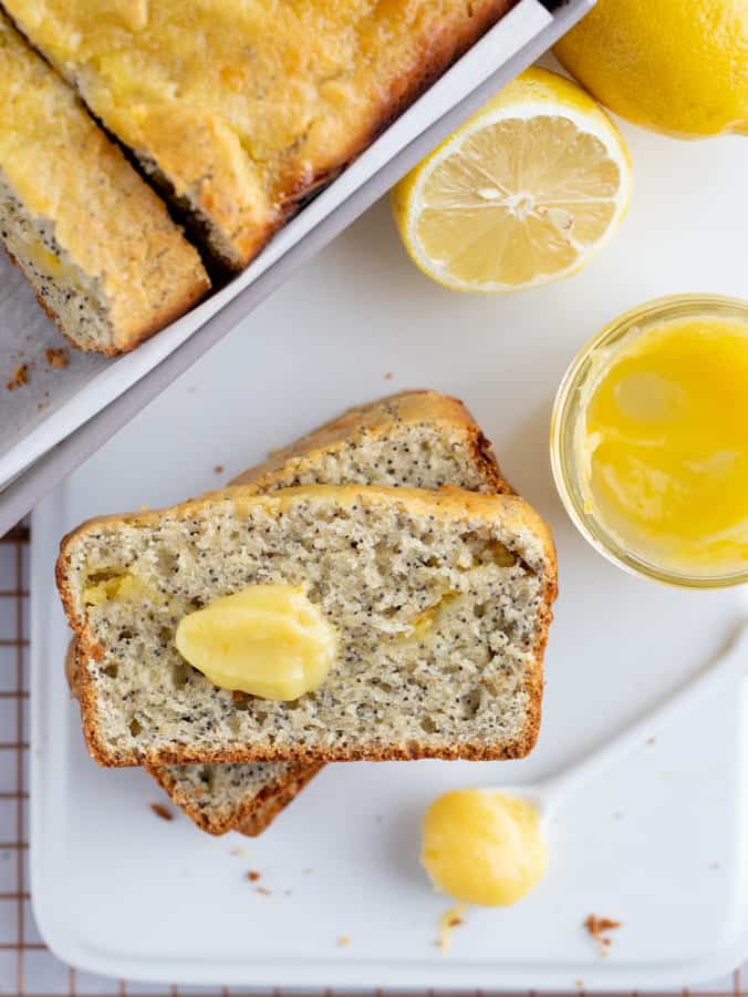 gluten free lemon poppy seed bread sliced on white platter