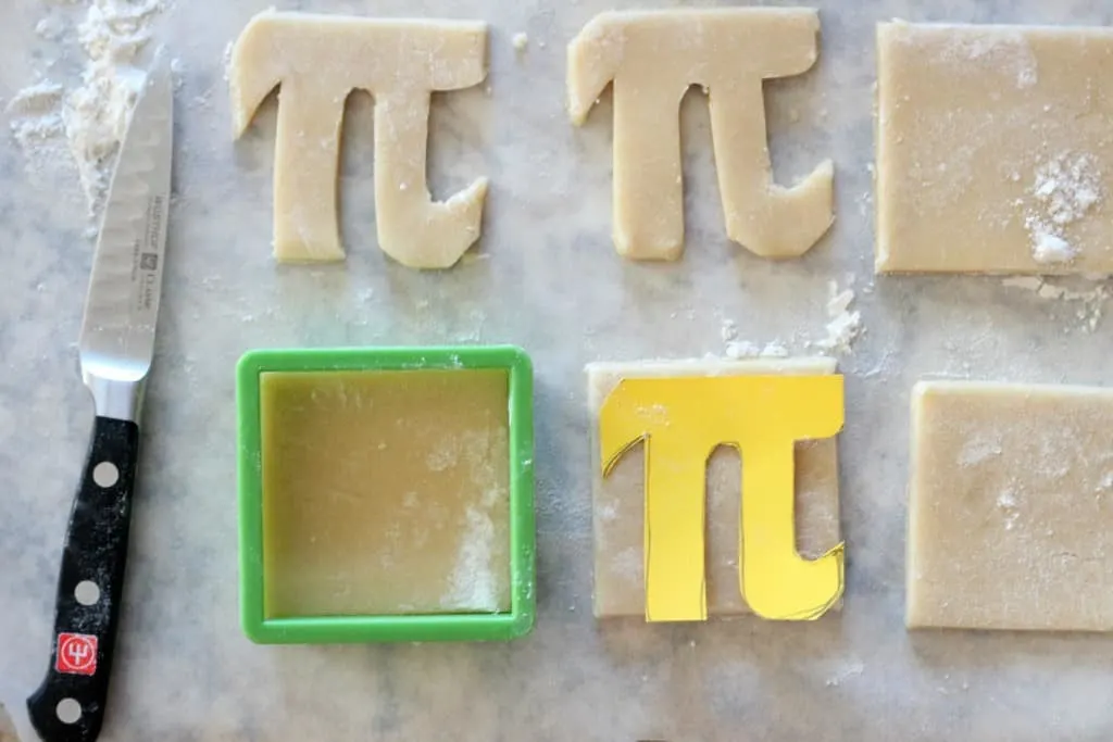 pi cookie template and raw cookie dough in the shape of Greek letter Pi