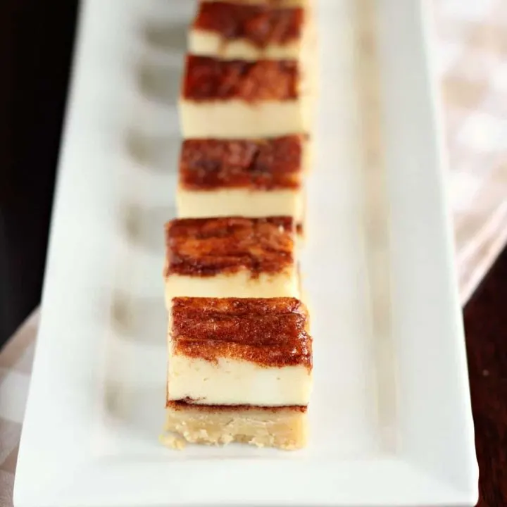 Churros cheesecake squares on a plate